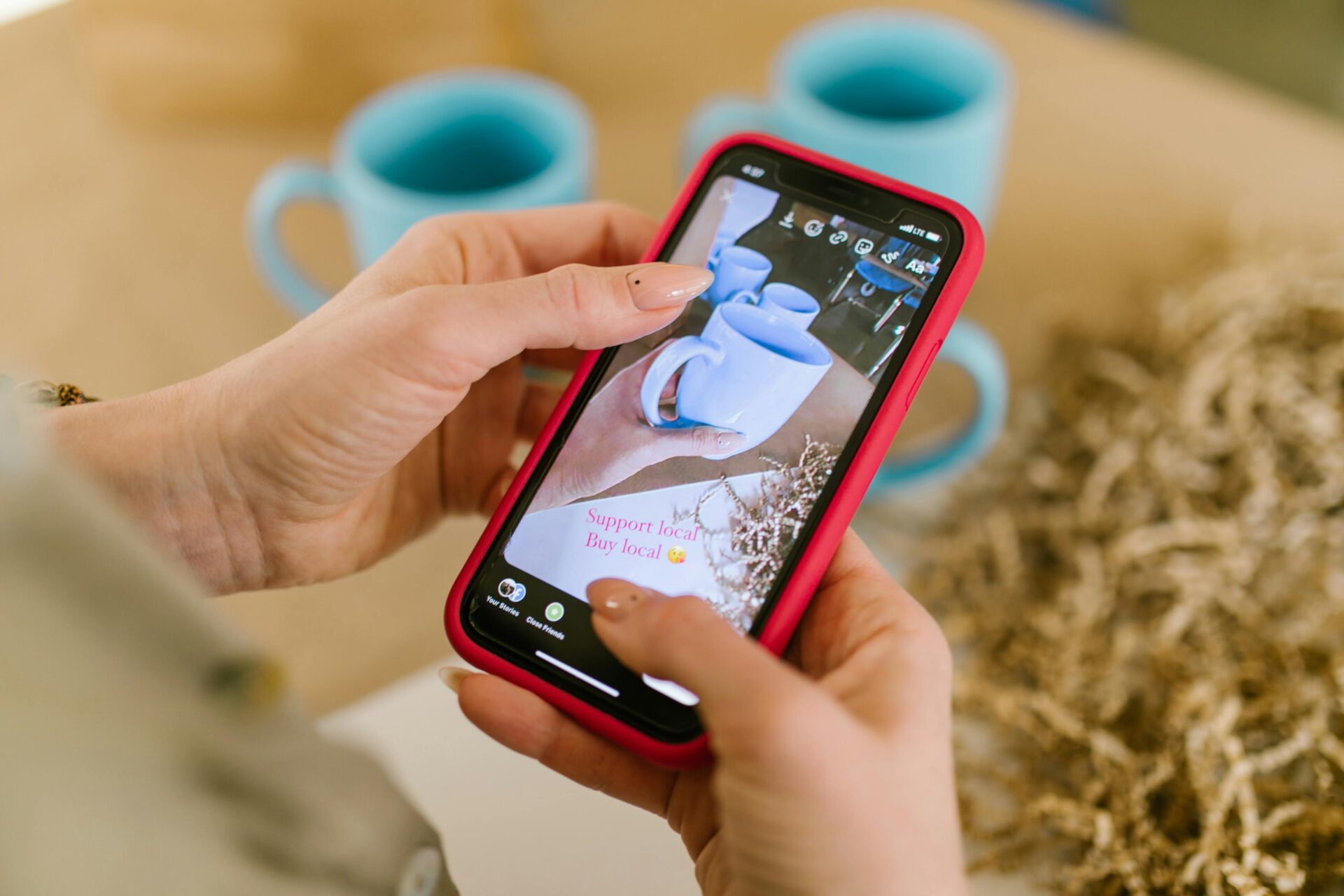 Image of Ceramic Cups on Smartphone Screen<br />